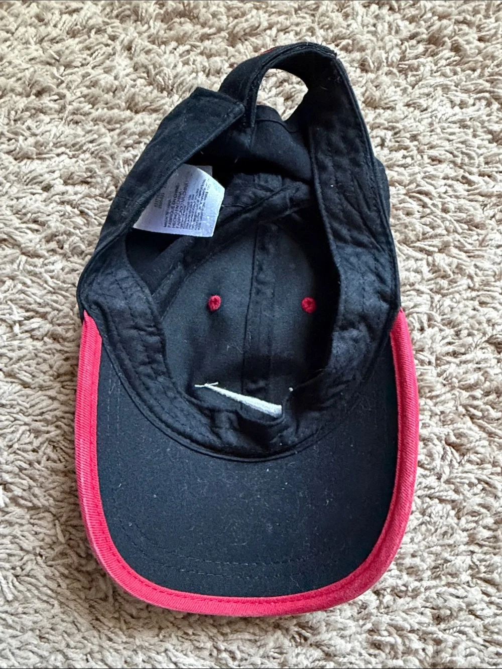 Nike Black Baseball Cap with White Swoosh and Red Accents for boys